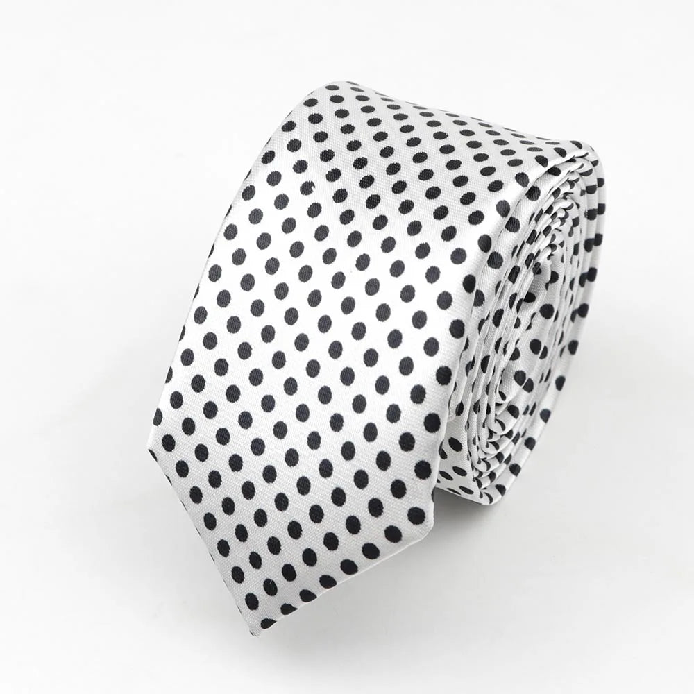 A sleek white satin skinny tie with black polka dots ideal as a colorful musical notes width necktie party accessory