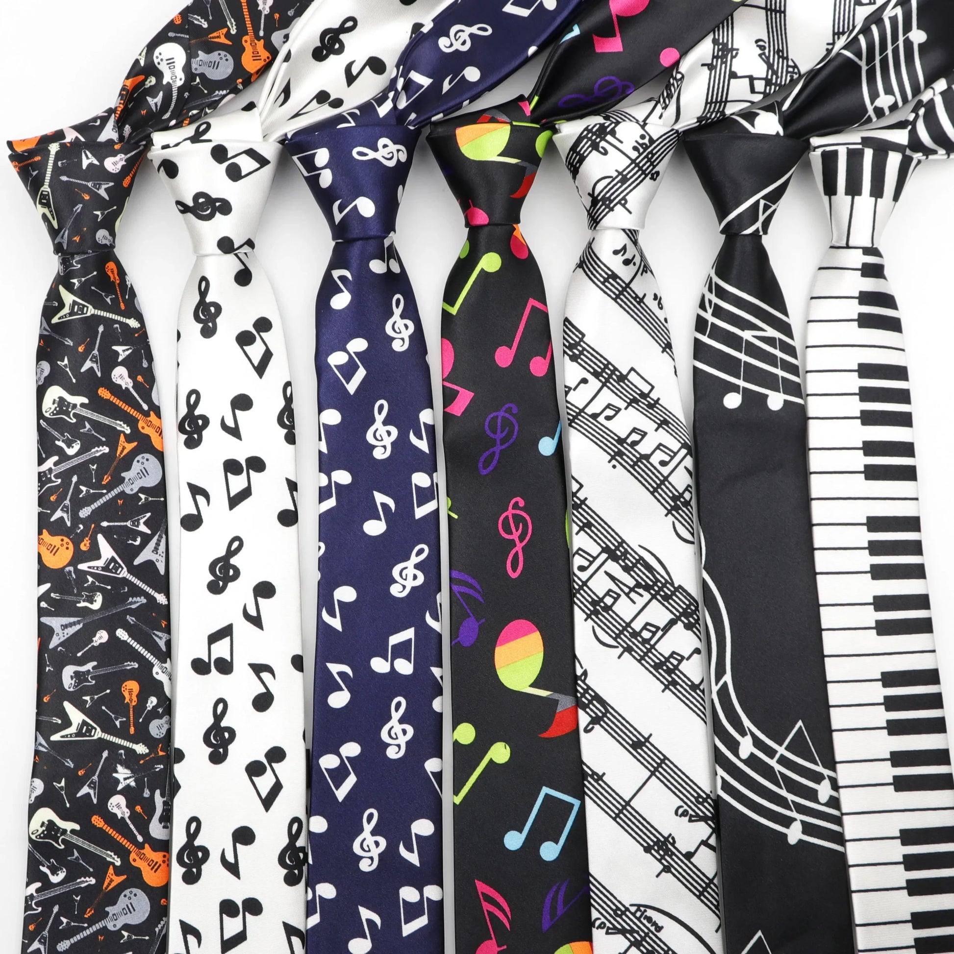 A collection of colorful polyester skinny ties with musical notes printed designs featuring guitars and piano keys ideal as width necktie party gift