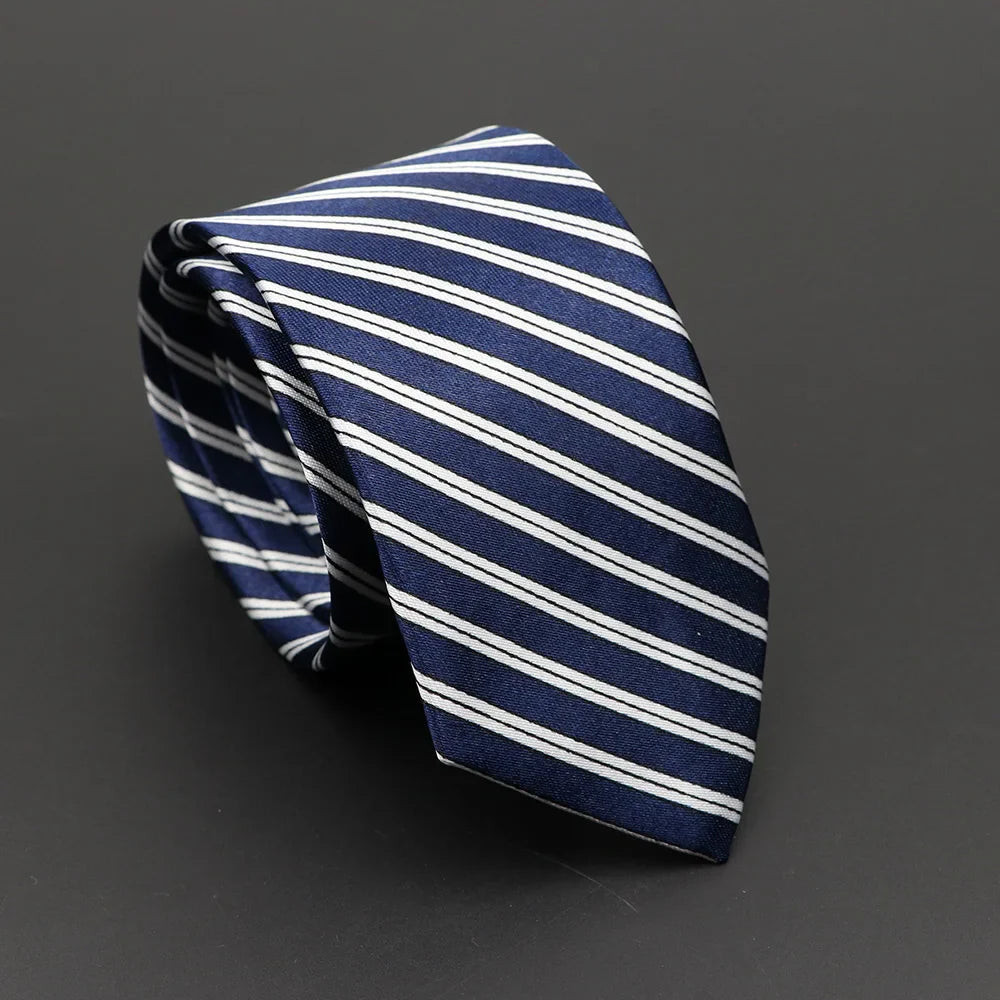 A navy blue silky narrow necktie with crisp white diagonal stripes perfect for classic musical notes style enthusiasts