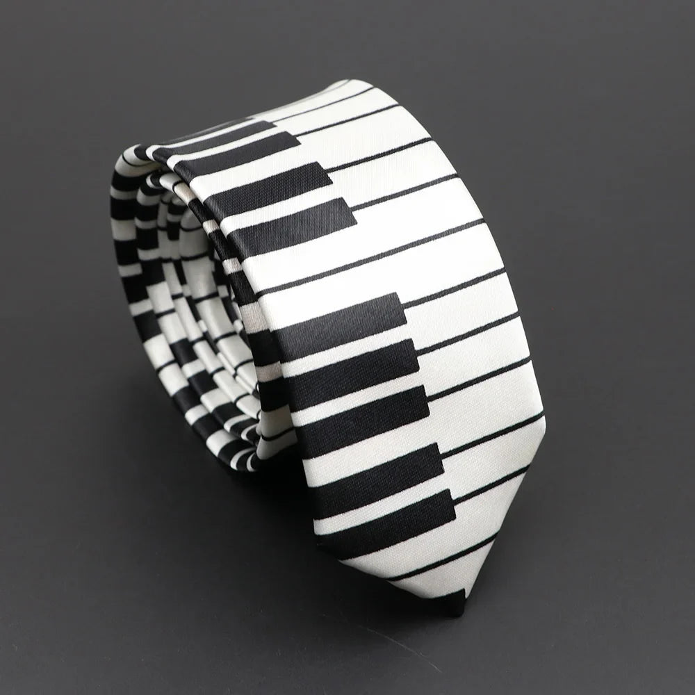 A sleek silky narrow necktie featuring a classic musical notes piano key pattern in black and white elegant design