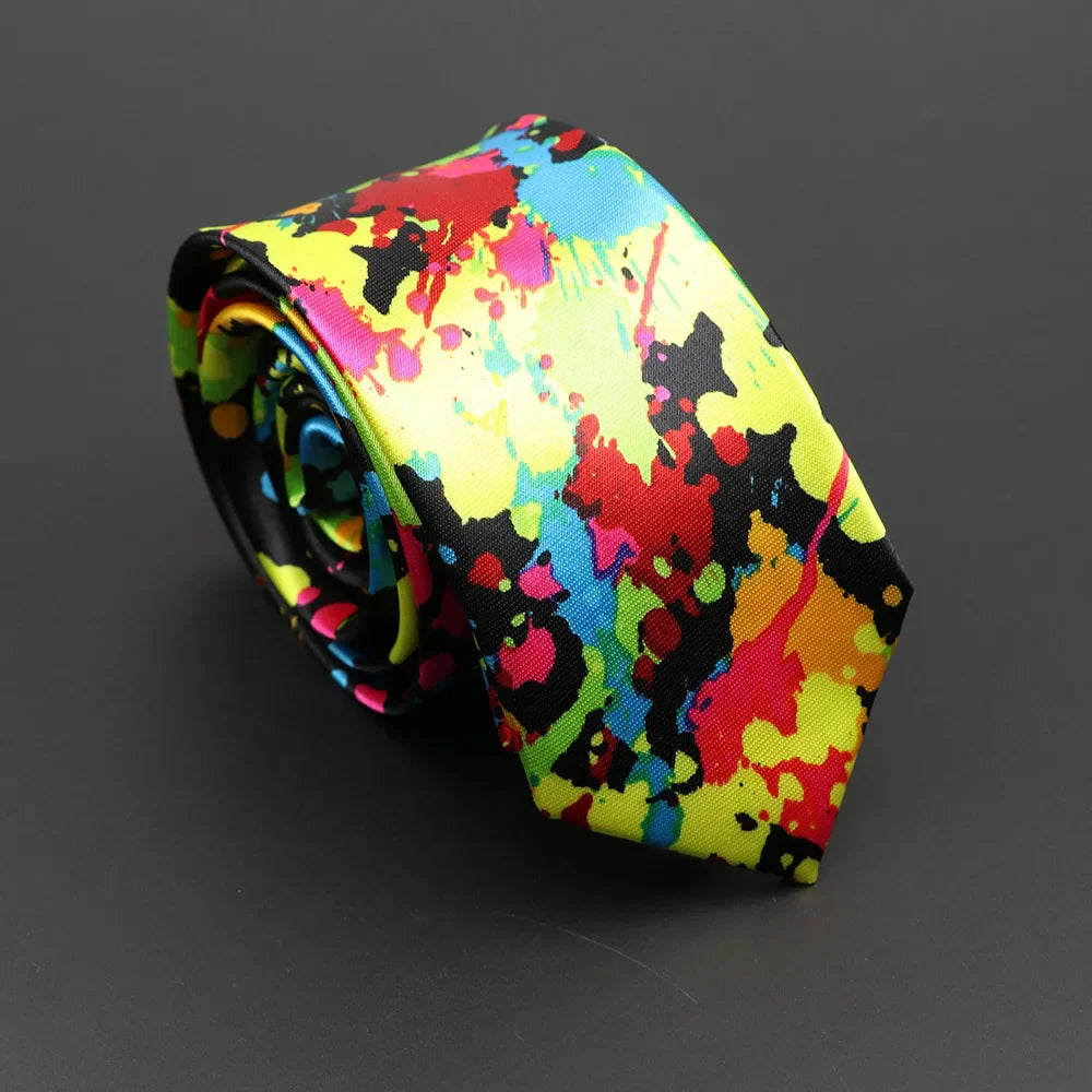 Classic musical notes silky narrow necktie with vibrant neon paint-splatter design in yellow red blue and pink on black background