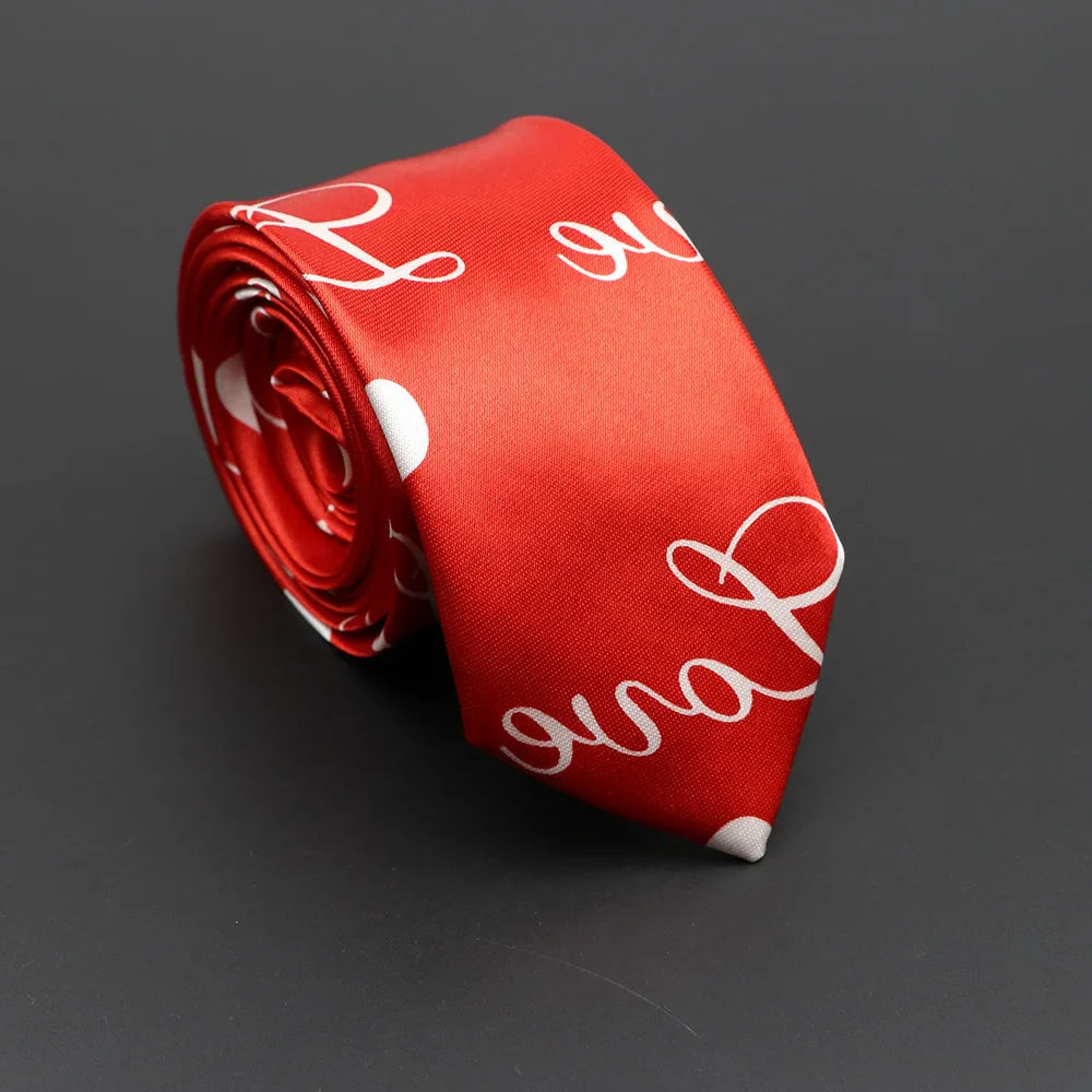 A vibrant red silky narrow necktie with classic musical notes and white cursive script polka dot pattern
