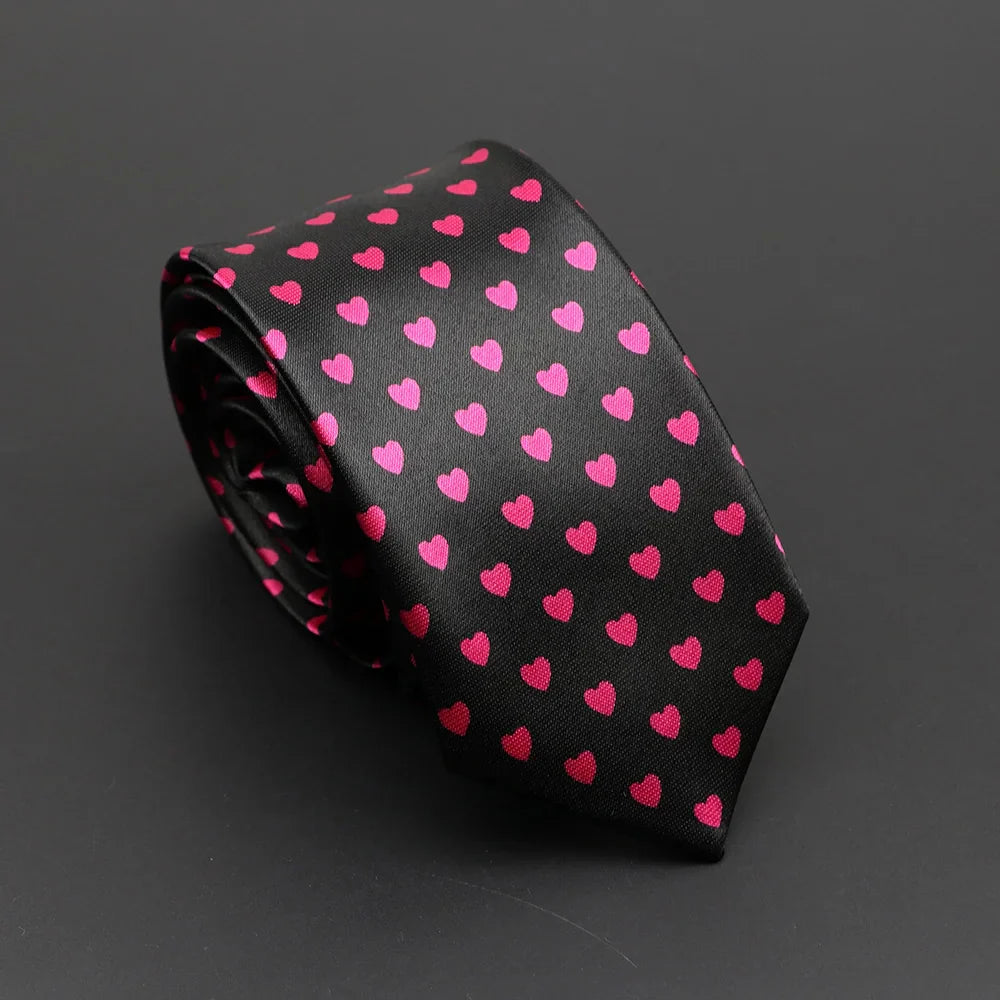 Black silk tie with vibrant pink hearts pattern paired with classic musical notes printed silky narrow necktie design