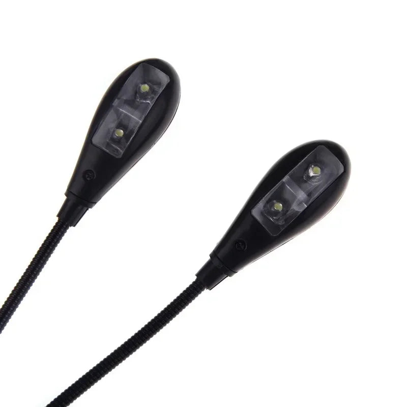Black clip-on music stand light with dual arms and teardrop led lights for piano violin musical instruments