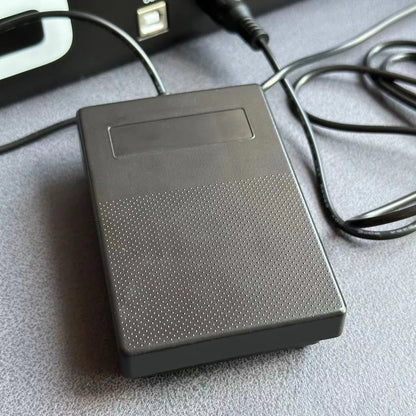 Black plastic compact sustain pedal with textured perforated surface and rectangular indentation for drum machines and keyboards