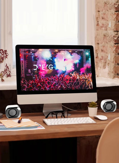 White all-in-one desktop computer featuring usb-powered desktop speaker with volume control and 3.5 mm audio plug