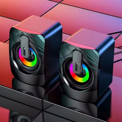 Black cube-shaped computer speakers with vibrant rgb lighting and usb wired connection for hifi stereo desktop use