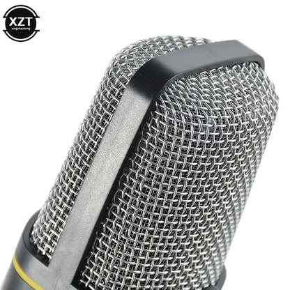 Silver mesh-covered condenser microphone professional with black top cap yellow accent band and tripod stand sf920
