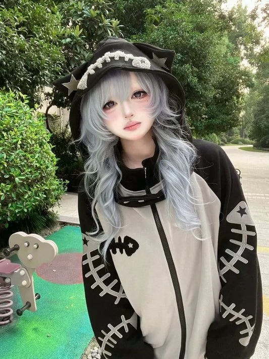 Black witch hat with silver star and pearl embellishments styled with women vintage y2k contrast color kawaii fish bone hoodies