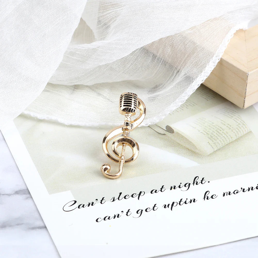 Gold-colored metal brooch featuring a fashion guitar microphone and music note enamel treble clef pendant charm
