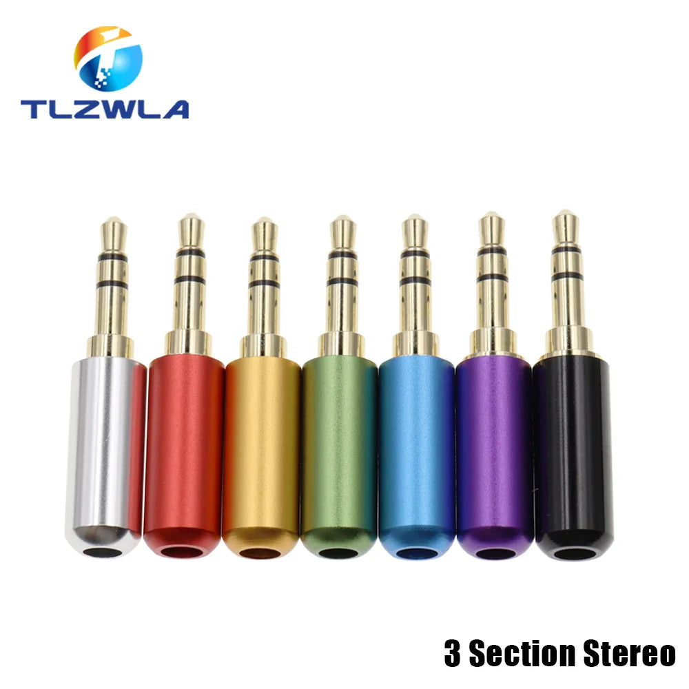 A set of seven colorful copper 3 section 3.5mm stereo audio adapters with metallic gold tips and aluminum bodies for 4mm cable