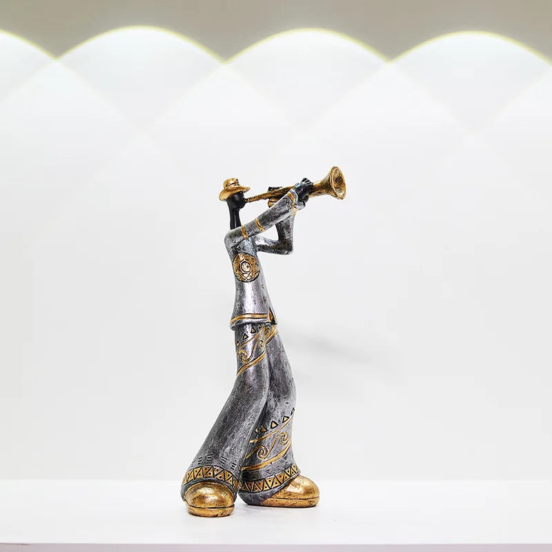 A silver and gold creative American band decoration musical figurine playing trumpet for porch study Nordic decor