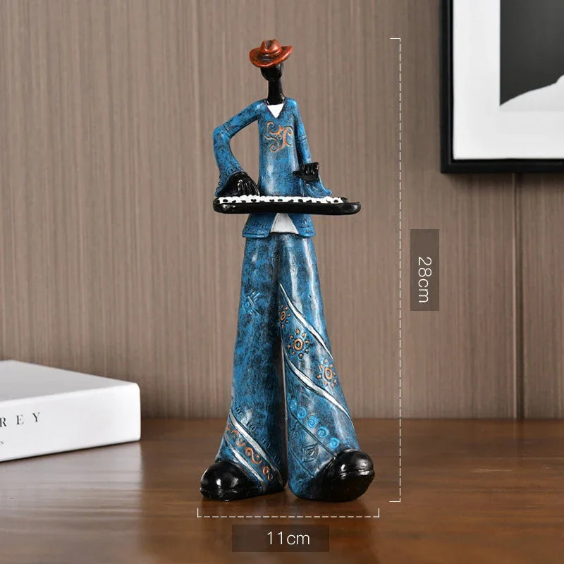 Blue patterned resin crafts statue sculpture of a creative American band musician holding a keyboard for porch study decor