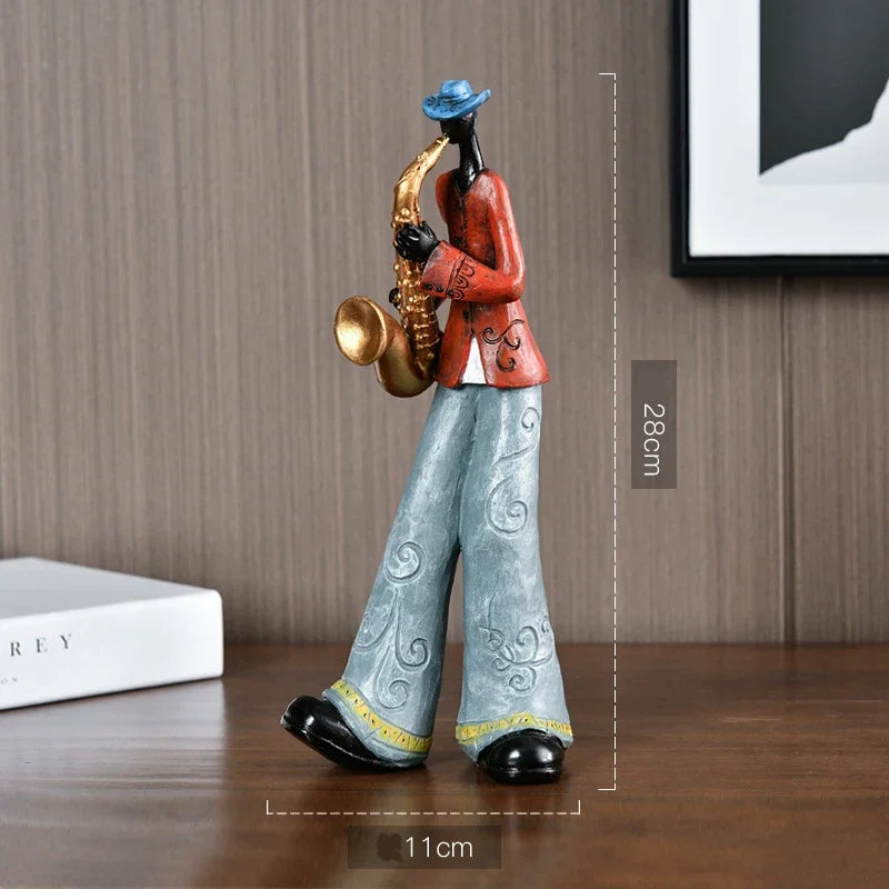 A creative American band crafts statue sculpture of a saxophonist in red jacket and blue hat for porch study Nordic decor