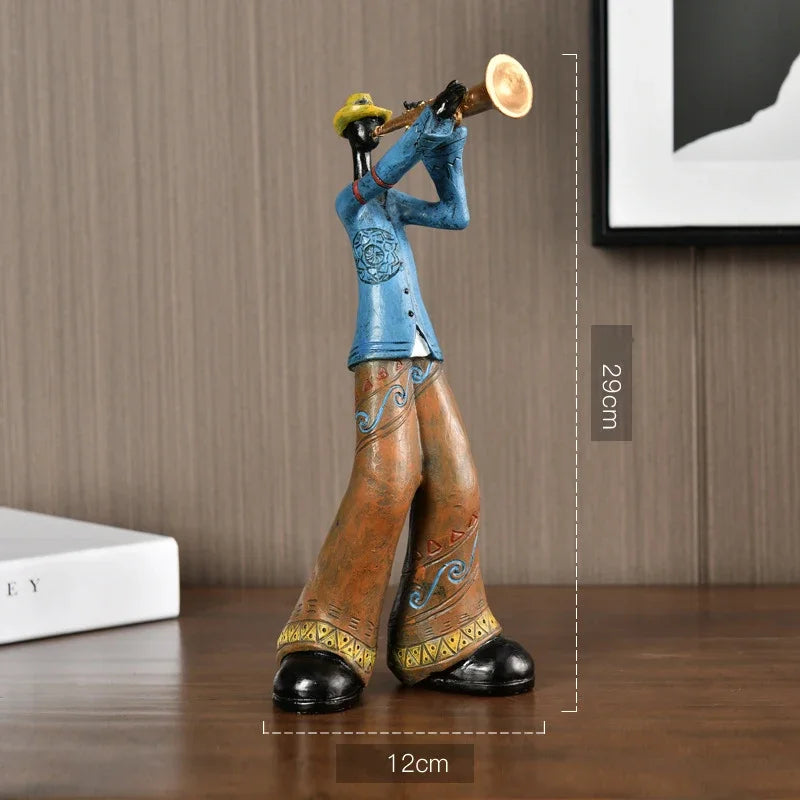 A creative american band crafts statue sculpture of a musician in blue and brown playing a brass trumpet for porch study decor