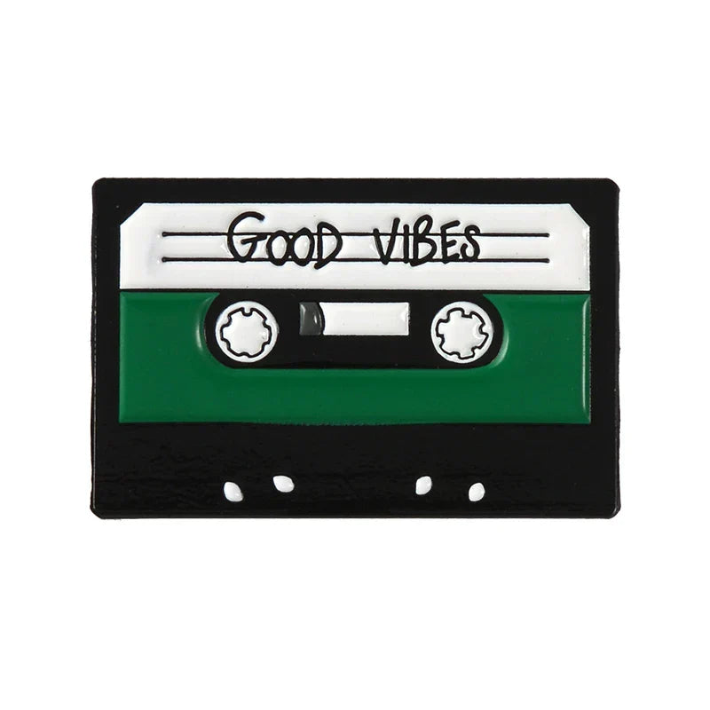 Creative music symbol enamel pin shaped like a green and black cassette tape with good vibes label in alloy brooch style