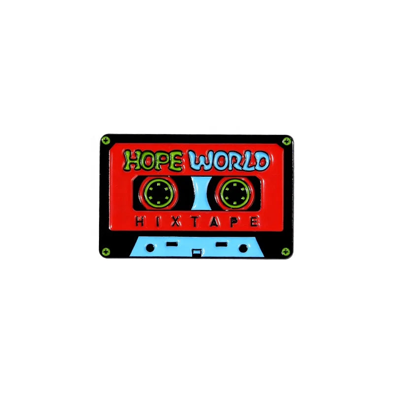 A vibrant red and blue enamel pin shaped like a cassette tape featuring creative music symbol design in headset alloy brooch