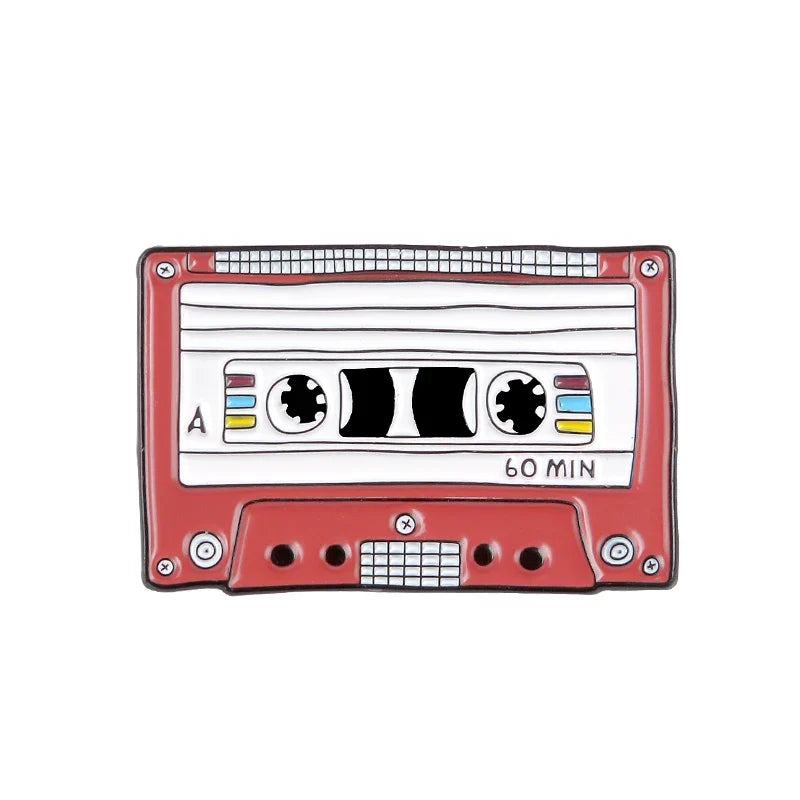 Red enamel pin shaped like vintage cassette tape with 60 min label featuring creative music symbol and headset alloy brooch design
