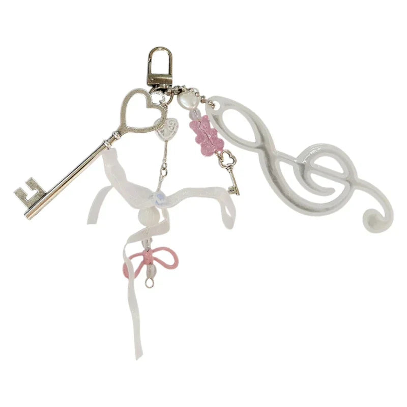 A delicate white and pink note keychain bowknot with silver skeleton key and music symbol keyring for backpack pendant theater gifts