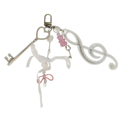 A delicate white and pink note keychain bowknot with silver skeleton key and music symbol keyring for backpack pendant theater gifts