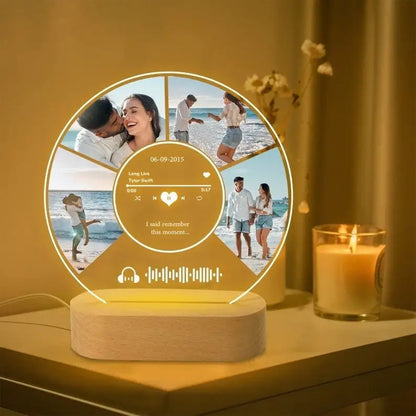 A glowing personalized music plaque with customized spotify music and transparent acrylic face on a wooden base