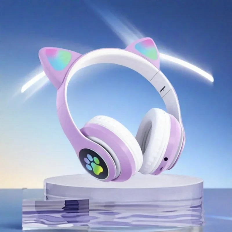 Pastel purple and white cute cat wireless headphones with glowing rainbow paw print accents and microphone noise cancelling
