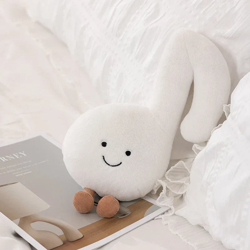 White plush cute musical plush toy shaped like a musical note with embroidered face and tan corduroy feet for kids gift