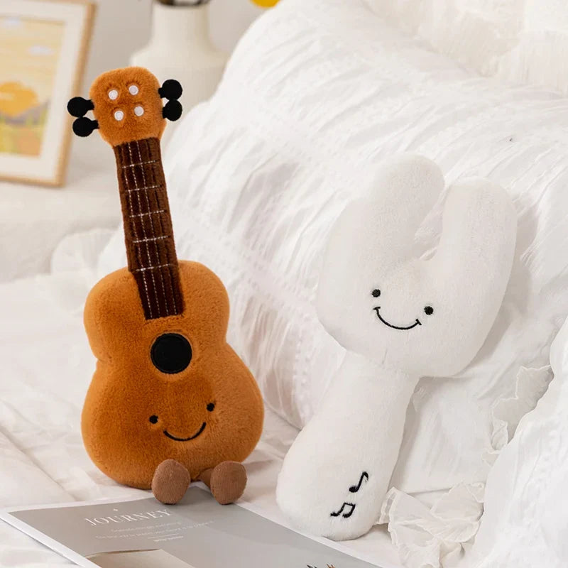 Orange plush ukulele with smiling face and black string details cute musical plush toy soft violin and pipa tuning fork gift