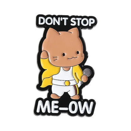 A tan enamel pin of a rock band cat dressed as freddie mercury holding a microphone with dont stop me ow text