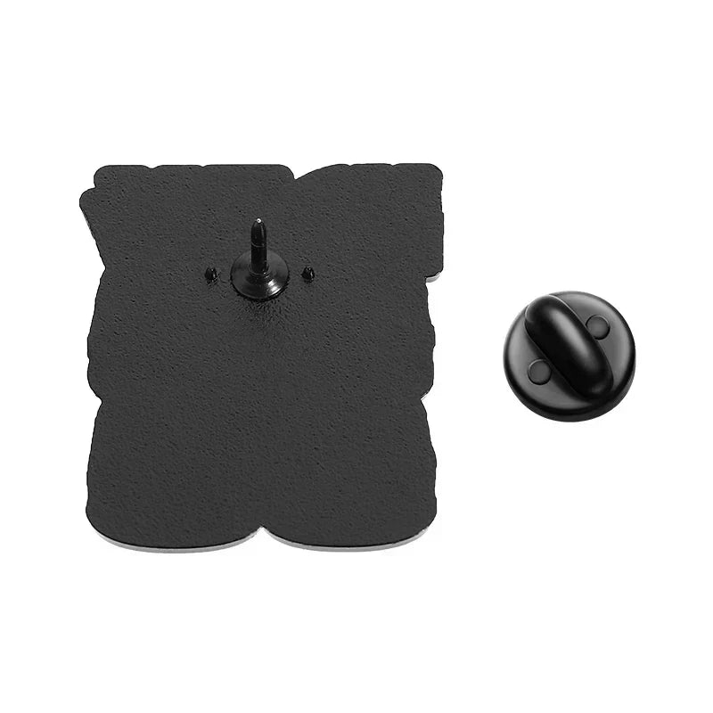 Black enamel pin with textured surface and rounded back clasp, ideal as rock band cats music kitten brooches or backpack lapel badge