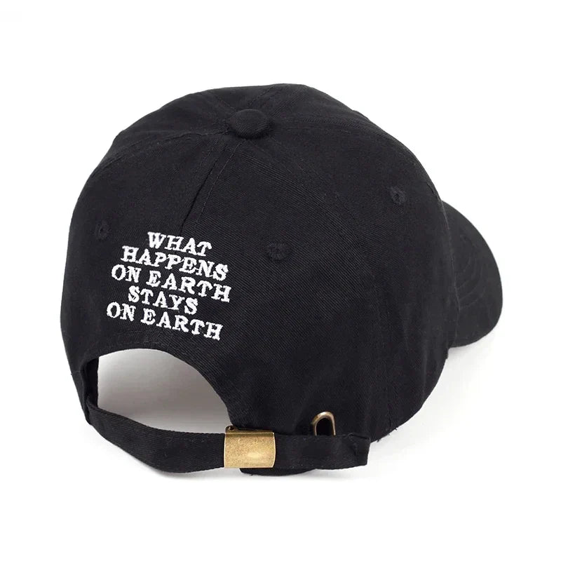 Black DAMN snapback baseball cap with white embroidered text and gold-tone adjustable strap for men and women
