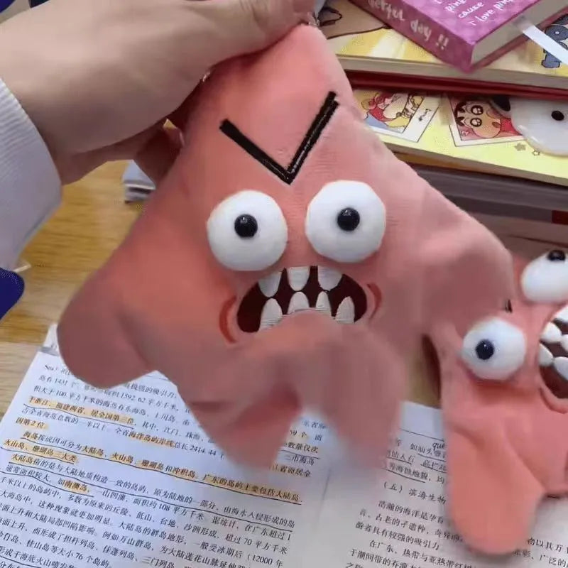 Pink plush monster hand puppet with googly eyes and sharp teeth as a doll backpack ornament for dancing stars plush gifts