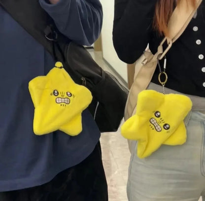 Bright yellow plush star-shaped keychain with embroidered face as a dancing stars plush doll backpack ornament and moving meteor pendant