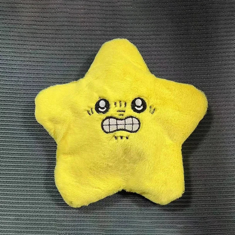 A bright yellow plush dancing stars plush toy with embroidered eyes grinning mouth as a doll backpack ornament