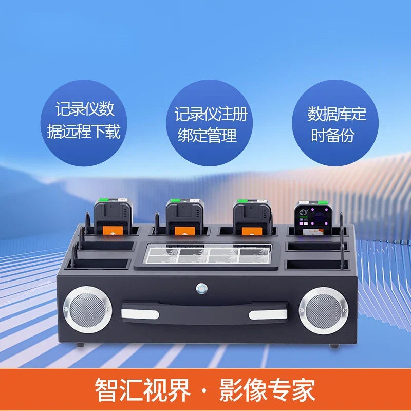 Black rectangular data collection station with four slots holding black and orange audio recorders featuring silver speakers