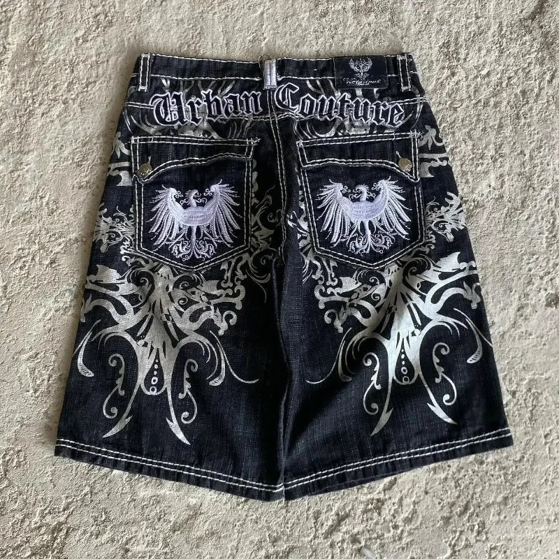 Black denim basketball shorts y2k with white silver embroidered eagle motifs and ornate scrollwork for hip hop heraldic style