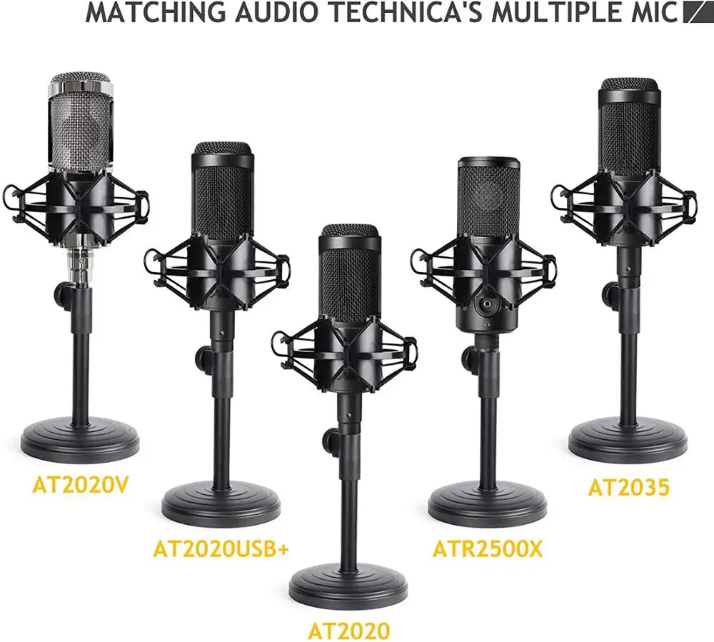 Black audio-technica studio microphones with metallic mesh grilles on an adjustable desktop microphone stand with shock mount