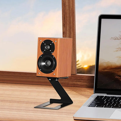 Wooden two-way speaker with black drivers on a desktop speaker stand with vibration absorption pad for game room bookshelf