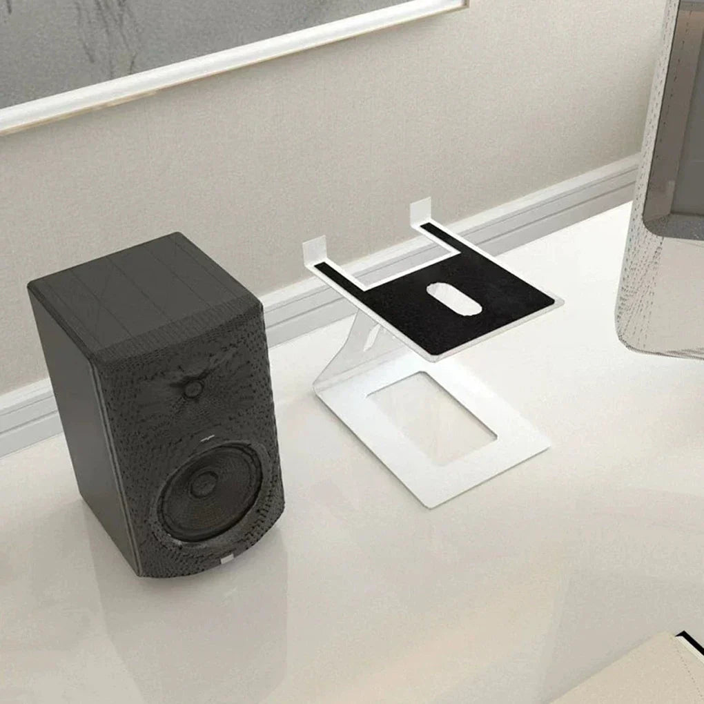 Black textured desktop speaker with circular driver and control knob on professional bookshelf speaker stand support