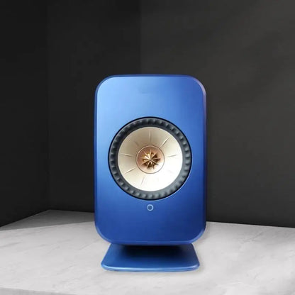 Blue rectangular desktop speaker with gold cream cone and metallic finish on professional studio monitors stand for surround sound speaker