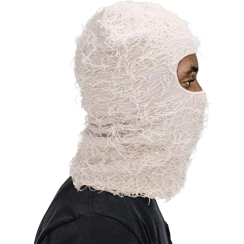 A white textured mesh distressed ski mask with lace-like pattern and open eye cutout for men and women