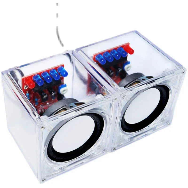 Diy mini speaker electronic kit featuring clear plastic cube with black drivers and visible transparent electronic components