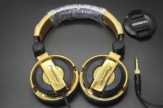 Gold-colored pioneer dj headphones with black accents and plastic headband for earphones dj music tuning earphones monitor mobile phone computer use