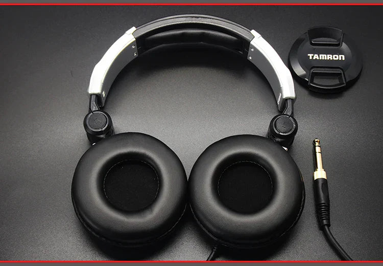 Black and silver over-ear earphones dj music with padded earcups and adjustable headband for mobile phone computer use
