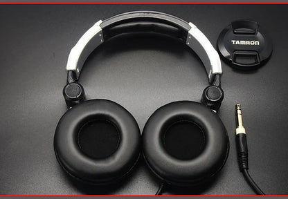 Black and silver over-ear earphones dj music with padded earcups and adjustable headband for mobile phone computer use