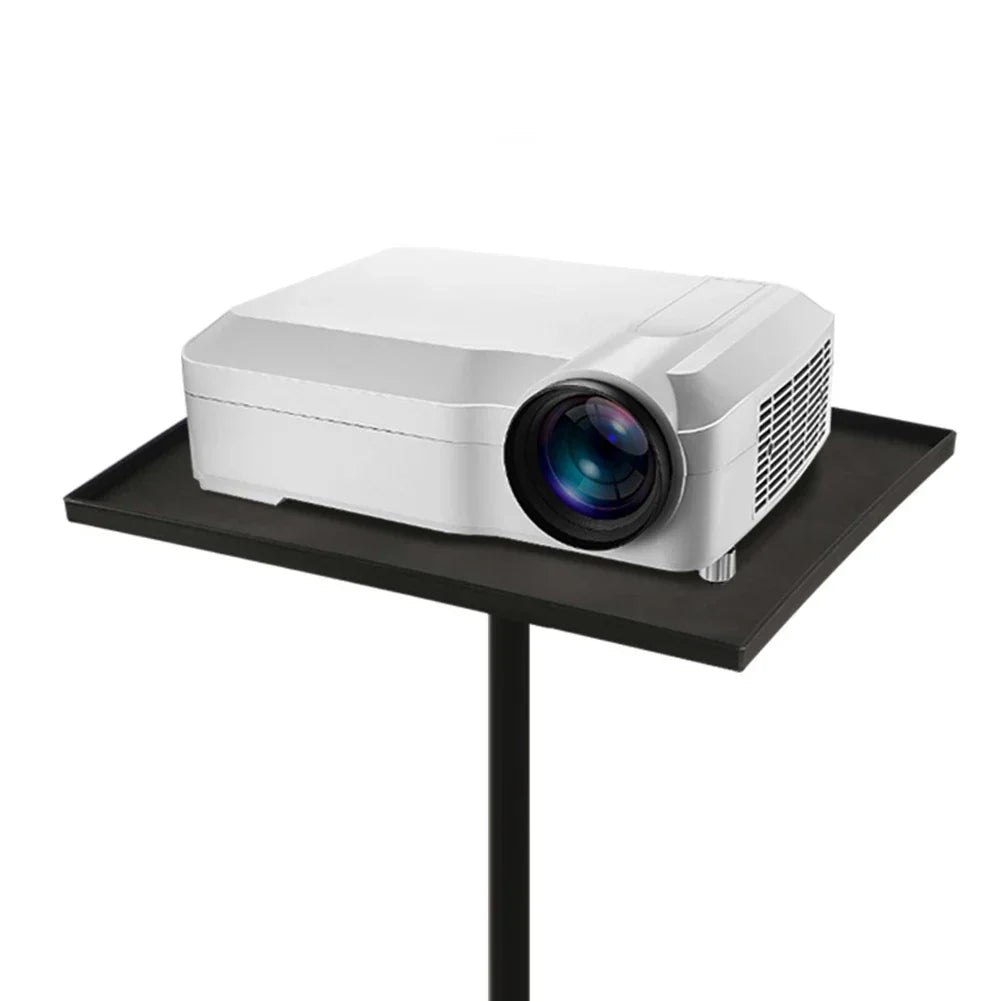 White projector with ventilation grilles resting on a black floor projector stand with telescopic rod standing 55cm