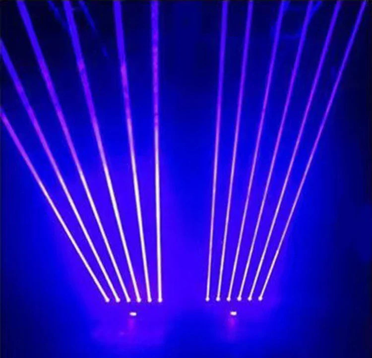 Purple and white laser beams from a laser projector 6x500mw eyes beam lasers with dmx control moving on dark blue stage