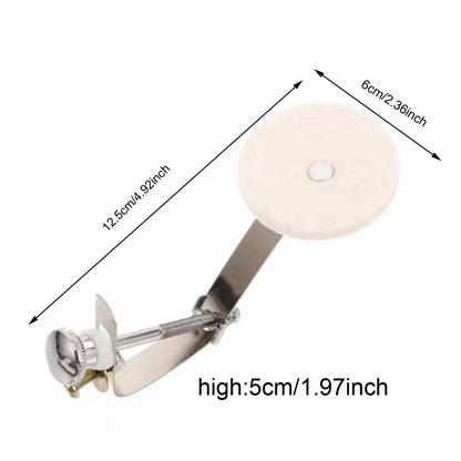 A sleek metallic drum damper mute with a circular white plastic top and adjustable screw mechanism for tone control