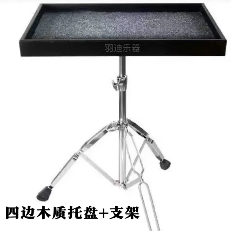 Black wooden drum kit paddle tray with textured gray surface mounted on chrome tripod stand paddle table