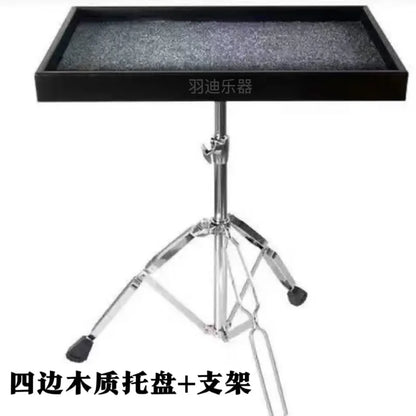 Black wooden drum kit paddle tray with textured gray surface mounted on chrome tripod stand paddle table